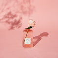Load image into Gallery viewer, Rose stood in Bonheur Grasse Rose Shampoo bootle