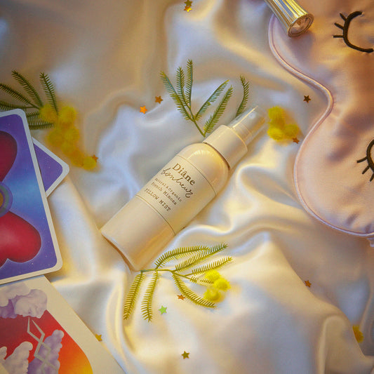 Mimosa Pillow Mist lay on bed